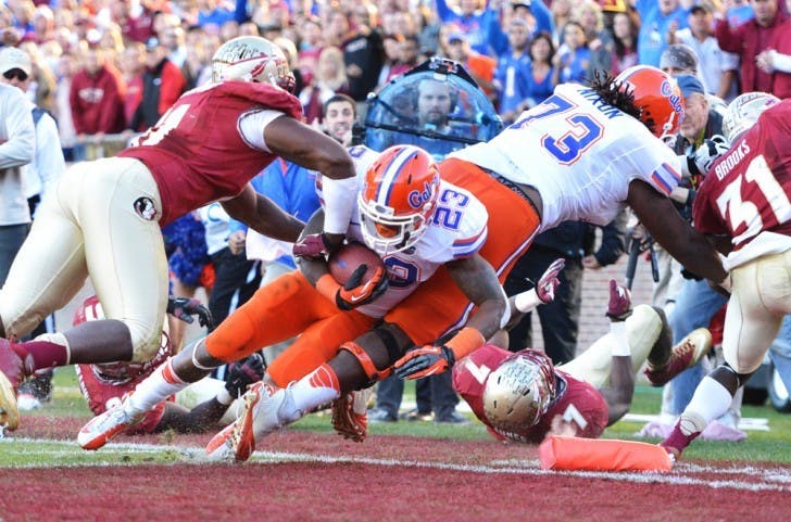 Running back Mike Gillislee dives into the end zone during Florida’s 37-26 win against Florida State on Saturday at Doak Campbell Stadium in Tallahassee. Gillislee ran for 140 yards and two scores in the win.

&nbsp;