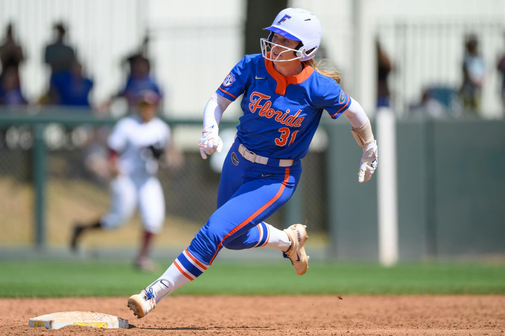 Florida infielder Kenleigh Cahalan (31) rounds second base during an NCAA softball game against Mississippi State, Saturday, April 4, 2026, in Gainesville, Fla.