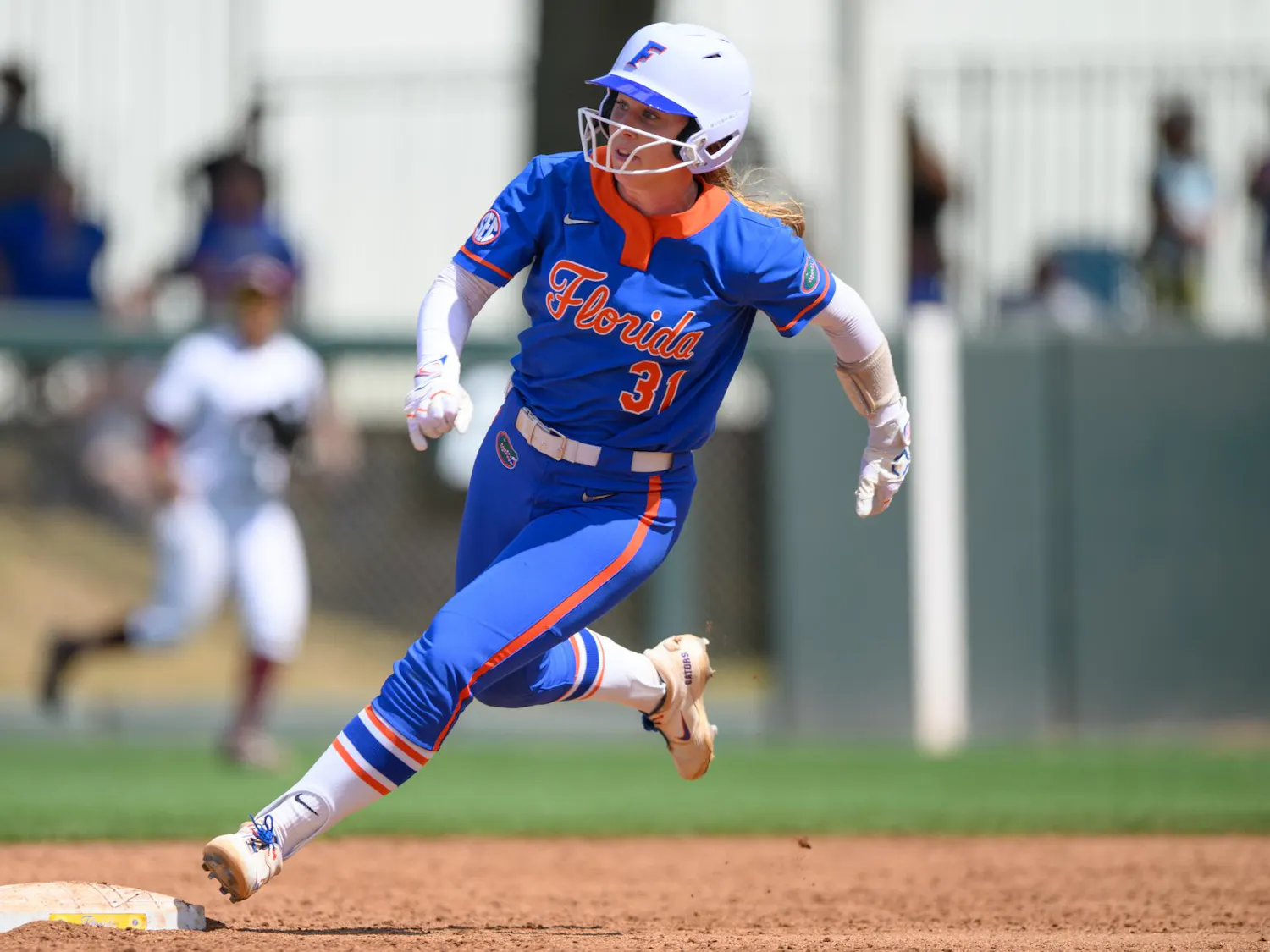 Florida infielder Kenleigh Cahalan (31) rounds second base during an NCAA softball game against Mississippi State, Saturday, April 4, 2026, in Gainesville, Fla.
