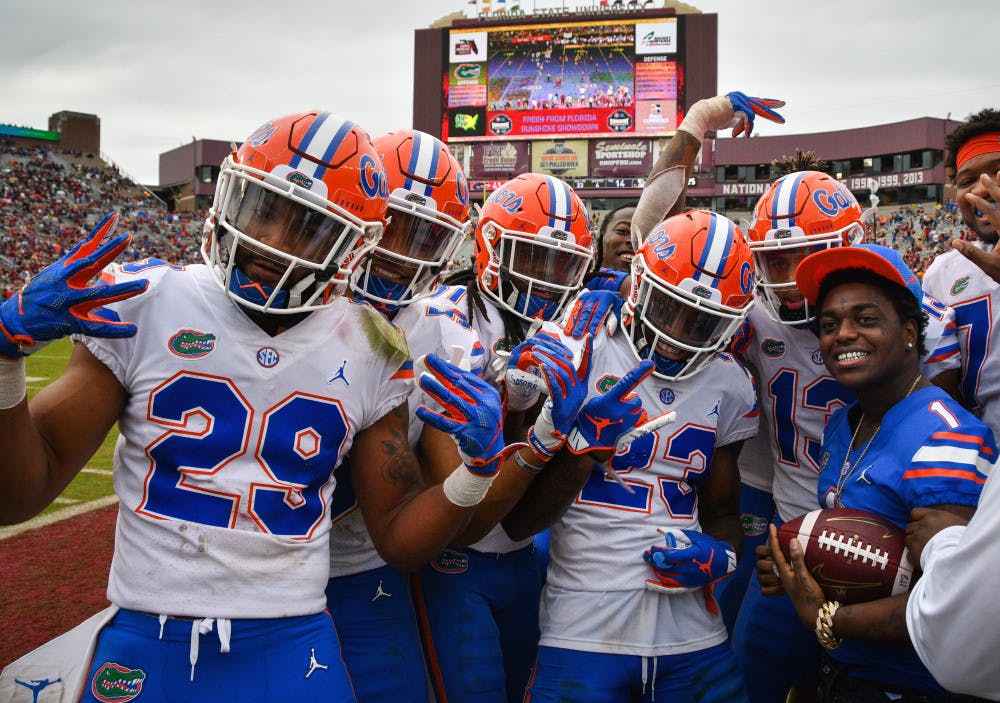 UF defensive players pose with rapper Kodak Black after presenting him with the football from the second interception of the fourth quarter. Players left to right: Jeawon Taylor (29), CJ Henderson (5), Shawn Davis (31), Chauncey Gardner-Johnson (23) and Donovan Stiner (13). 