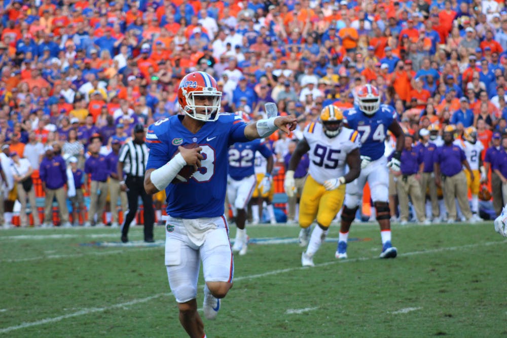 UF quarterback Feleipe Franks calls out for a block while running with the ball during Florida's 17-16 loss to LSU on Saturday at Ben Hill Griffin Stadium.