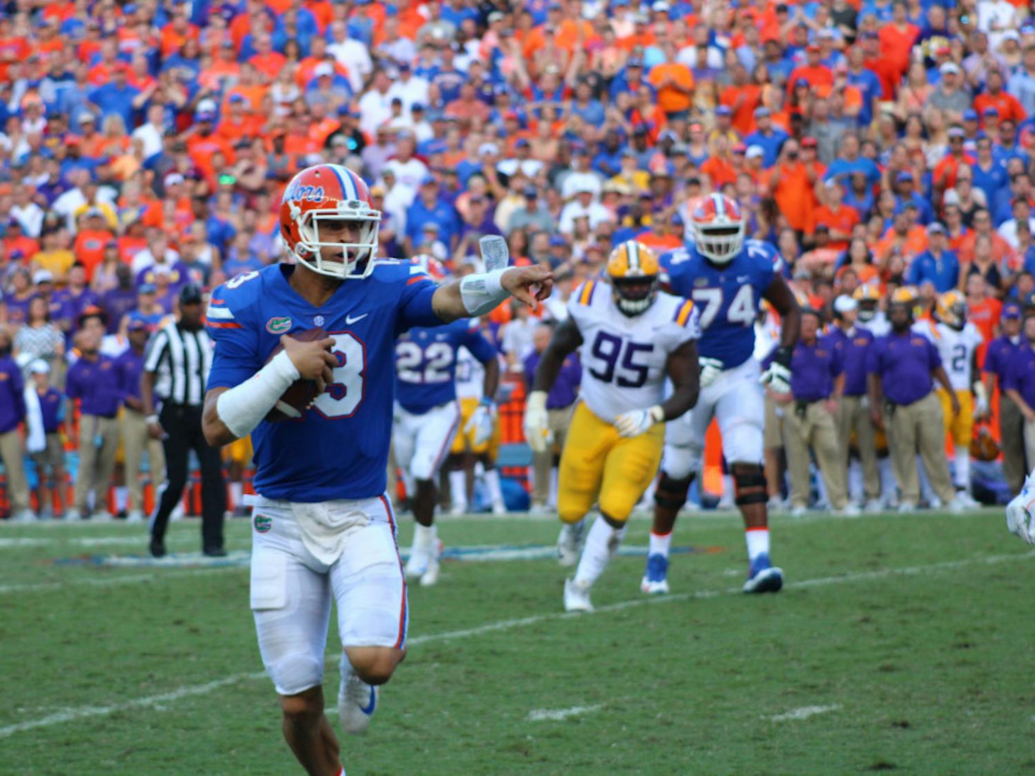 UF quarterback Feleipe Franks calls out for a block while running with the ball during Florida's 17-16 loss to LSU on Saturday at Ben Hill Griffin Stadium.