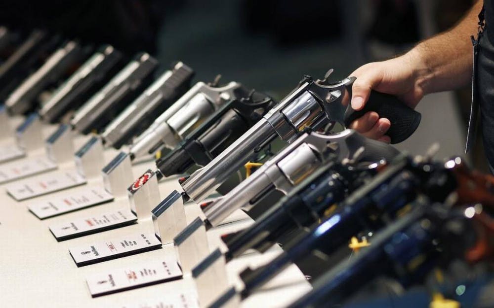 In this Jan. 19, 2016 file photo, handguns are displayed at the Smith &amp; Wesson booth at the Shooting, Hunting and Outdoor Trade Show in Las Vegas.