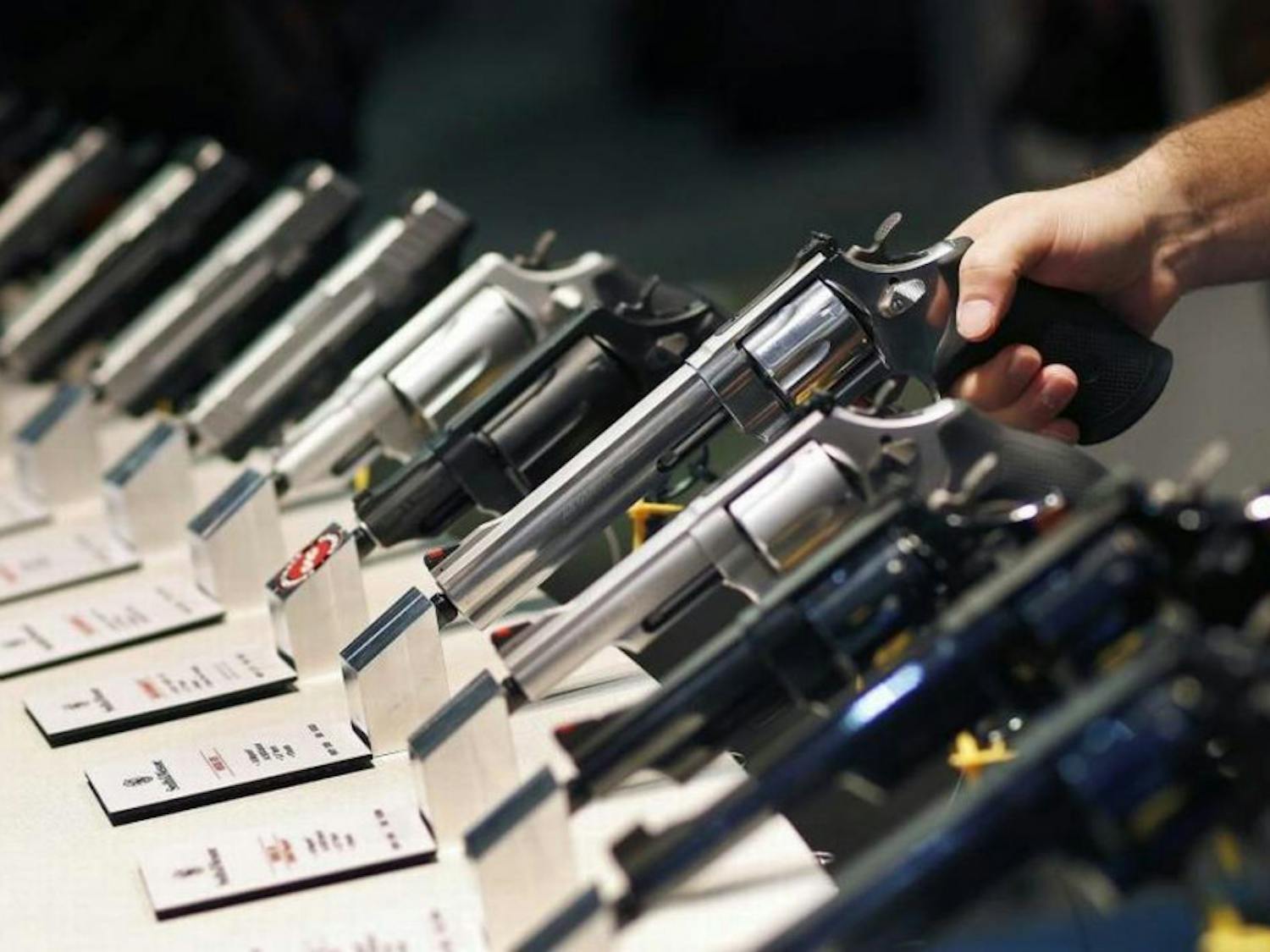 In this Jan. 19, 2016 file photo, handguns are displayed at the Smith &amp; Wesson booth at the Shooting, Hunting and Outdoor Trade Show in Las Vegas.