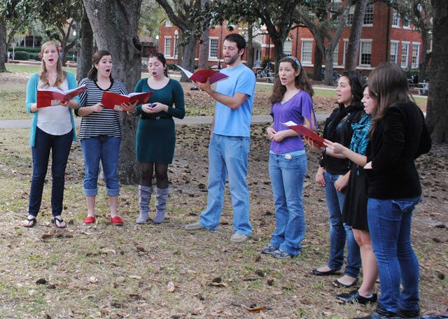 A group of vocal students from UF's College of Fine Arts carol outside Library West on Monday afternoon to showcase their skills and get into the holiday spirit.
