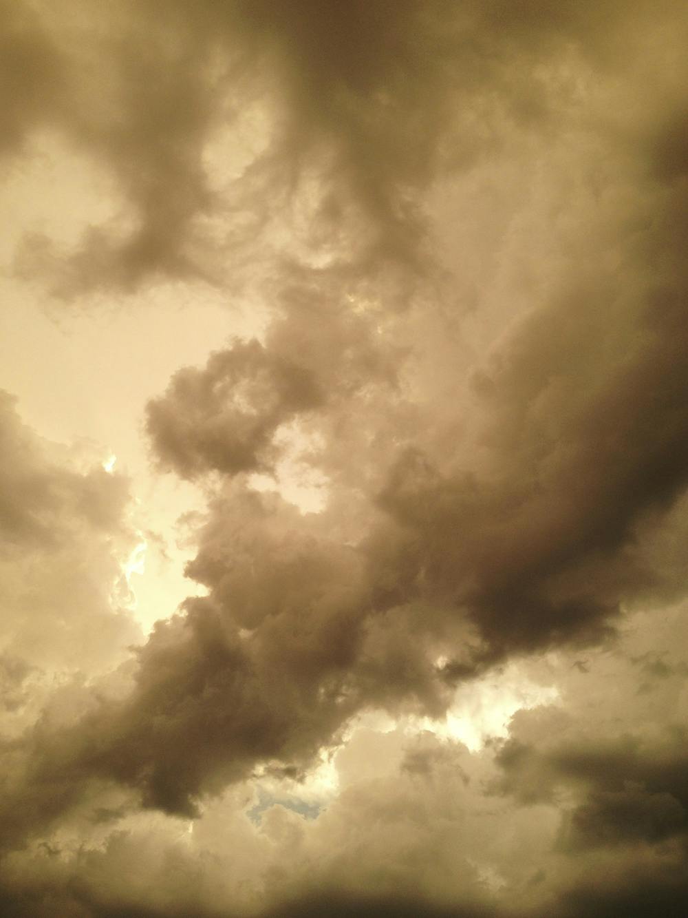Clouds form a storm above the Museum Walk apartment complex in September.