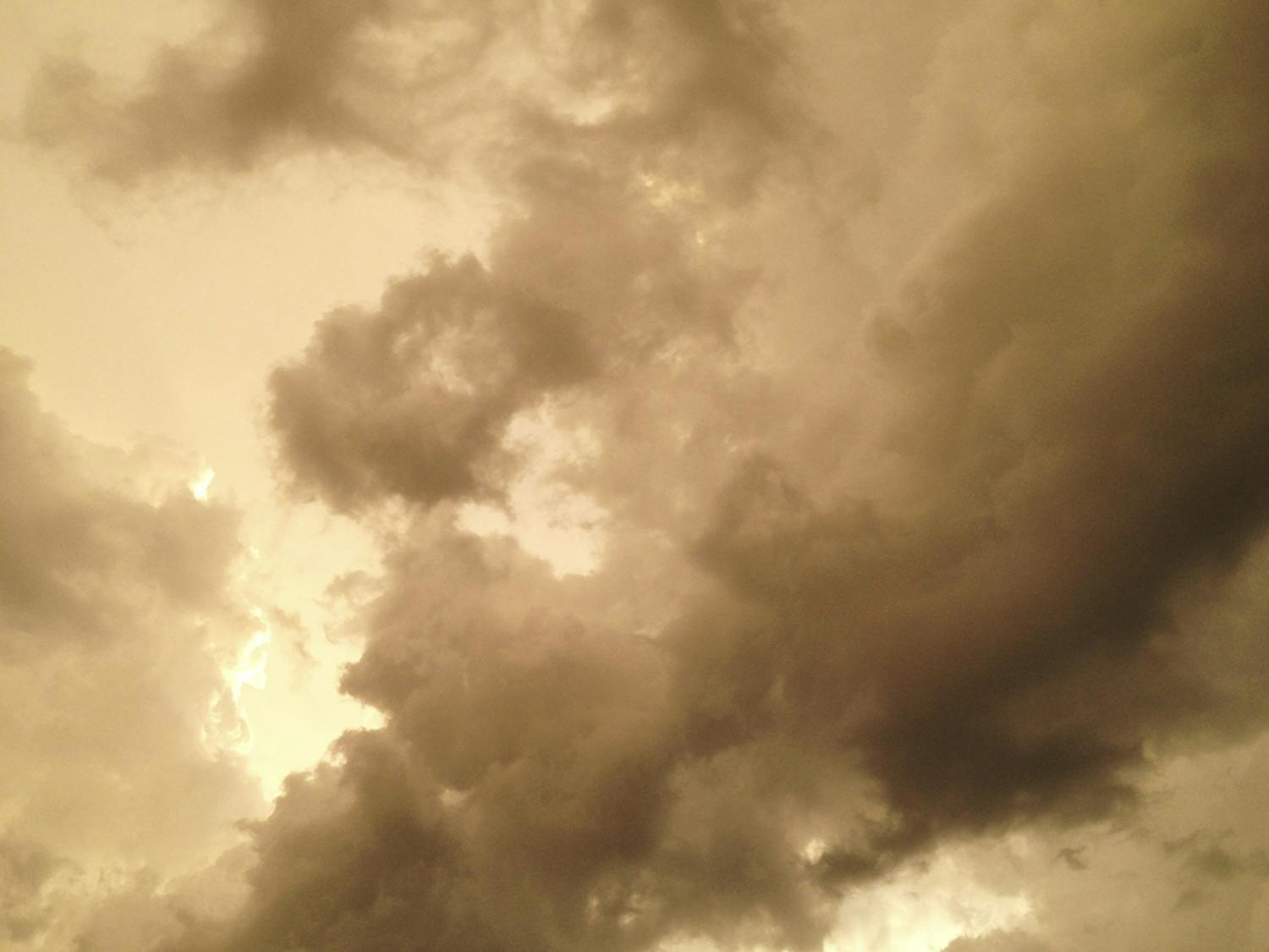 Clouds form a storm above the Museum Walk apartment complex in September.