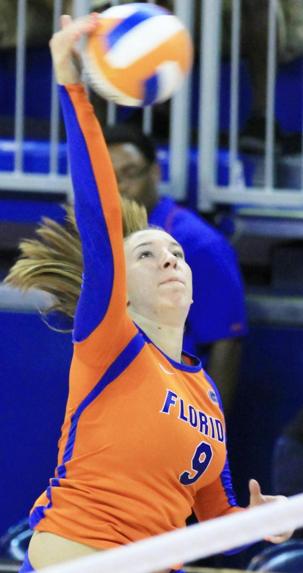 <p>Ziva Recek (9) spikes the ball over the net against Florida Gulf Coast University, Aug. 25, 2012, at the O'Connell Center. Recek took a team-high 40 swings Friday night against LIU-Brooklyn.</p>