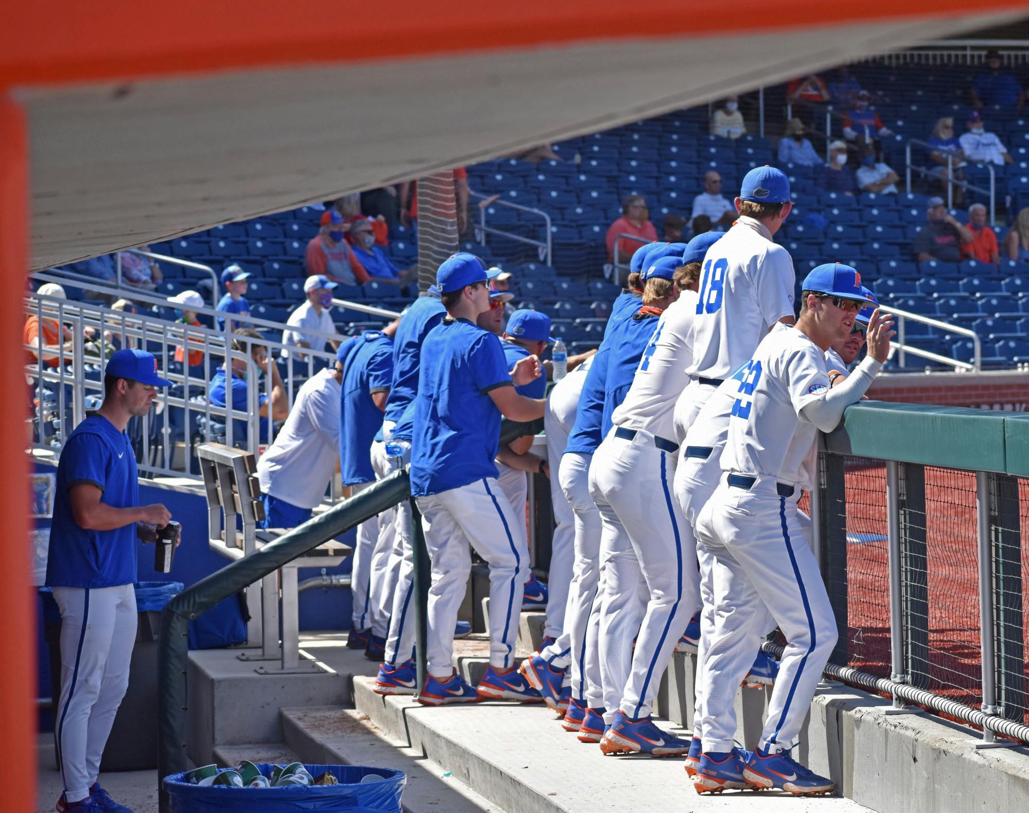 The Florida baseball team stands in the dugout during a game against Jacksonville on March 14, 2021. The Gators host the LSU Tigers for a three-game slate