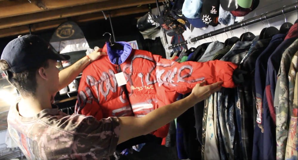 Drew Howard, 23, holds a jacket from his brand Always True, which is named after his late brother’s rap name. He runs the company with 24-year-old Kevin Masaro. 