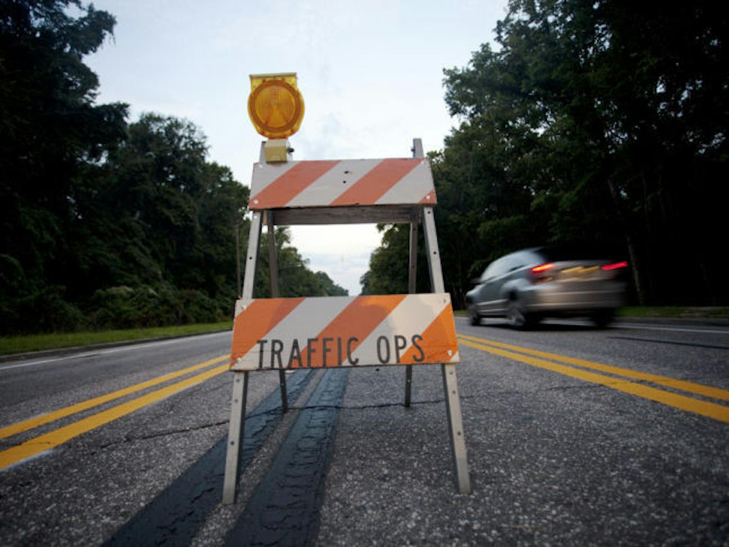 Barricades along Northwest Eighth Avenue designated a new traffic pattern the city introduced Sunday as a trial to improve traffic flow and pedestrian safety.
