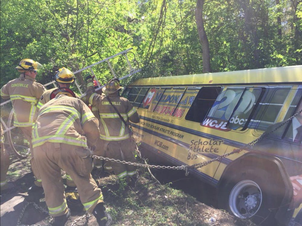 <p>A bus carrying at least 15 passengers ended up in a ditch Wednesday morning at the 300 block of Northeast 39th Avenue, Gainesville Police said.</p>