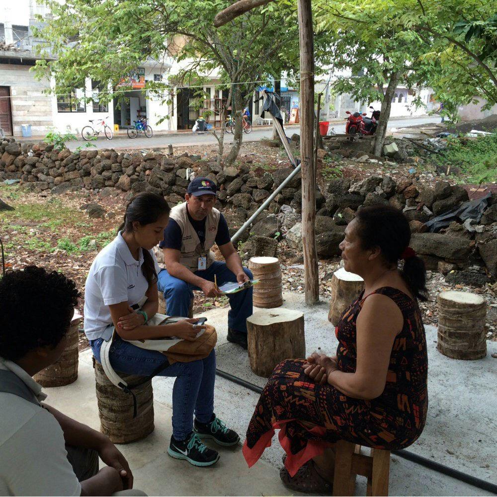Sadie J. Ryan sits with team members to interview a resident of the Galápagos Islands to collect data for her study about dengue fevers effects on the people who live there.&nbsp;
&nbsp;