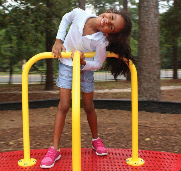 Auriel Shupack, 7, plays at the Albert “Ray” Massey Westside Park, 1001 NW 34th St., Tuesday afternoon.