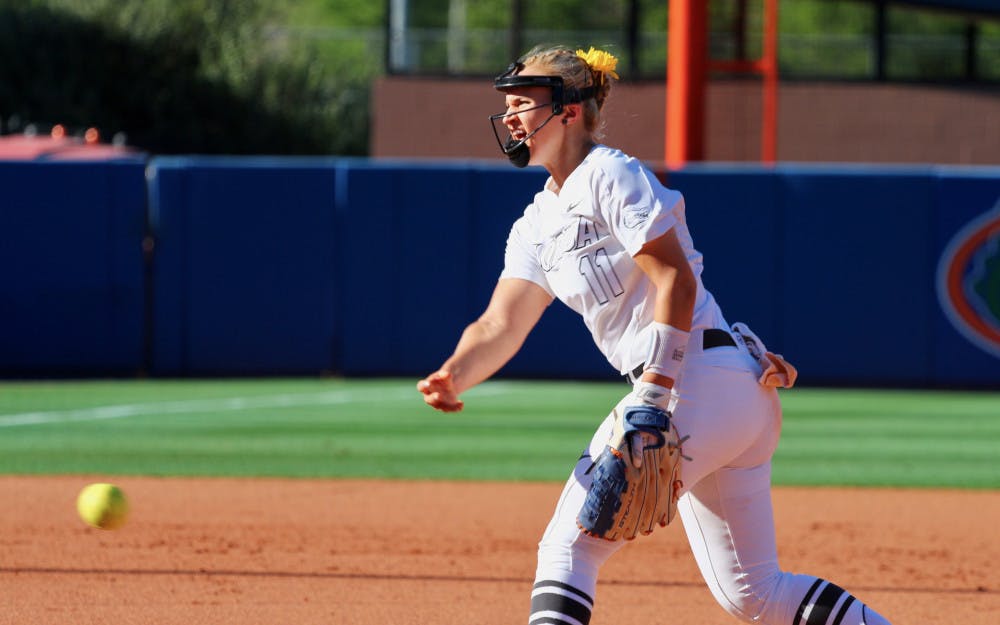 <p>Kelly Barnhill tosses a pitch in the Gators' 5-0 win over the Georgia Bulldogs on Saturday. </p>