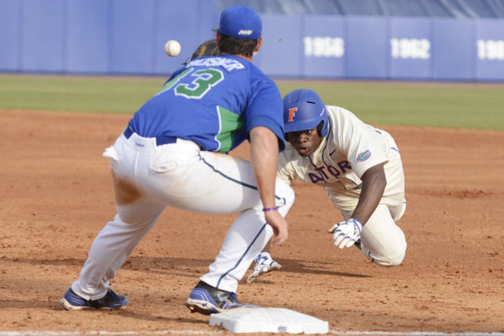 <p class="p1"><span class="s1">Sophomore infielder Josh Tobias attempts to get back on first base on a pickoff attempt during Florida’s 8-3 loss to FGCU on Feb. 23 at McKethan Stadium.</span></p>