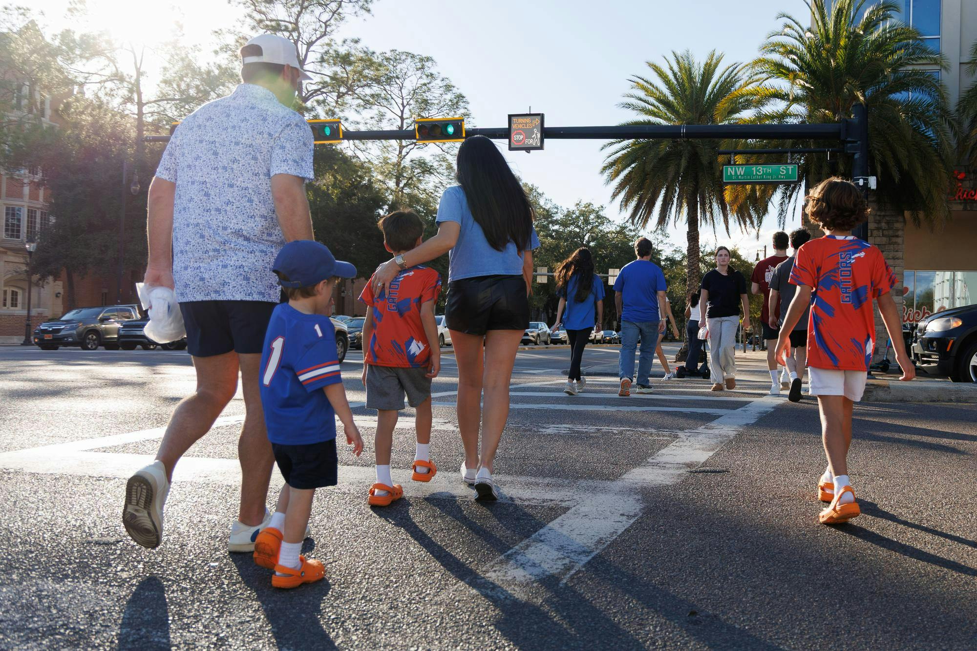 Pedestrians crossing at University Avenue and NW 13th Street, Saturday, Jan. 10, 2025.