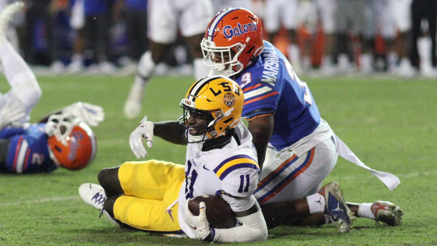 LSU wide receiver Brian Thomas Jr. after a reception with UF cornerback Jason Marshall Jr. in coverage Saturday, Oct. 15, 2022. 