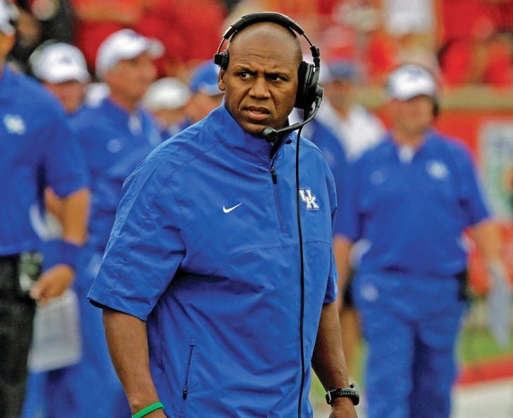 Kentucky coach Joker Phillips reacts after his team failed to make a first down against in their season-opening NCAA college football game against Louisville at Cardinal Stadium in Louisville, Ky., Sunday, Sept. 2, 2012. Louisville won 32-14.