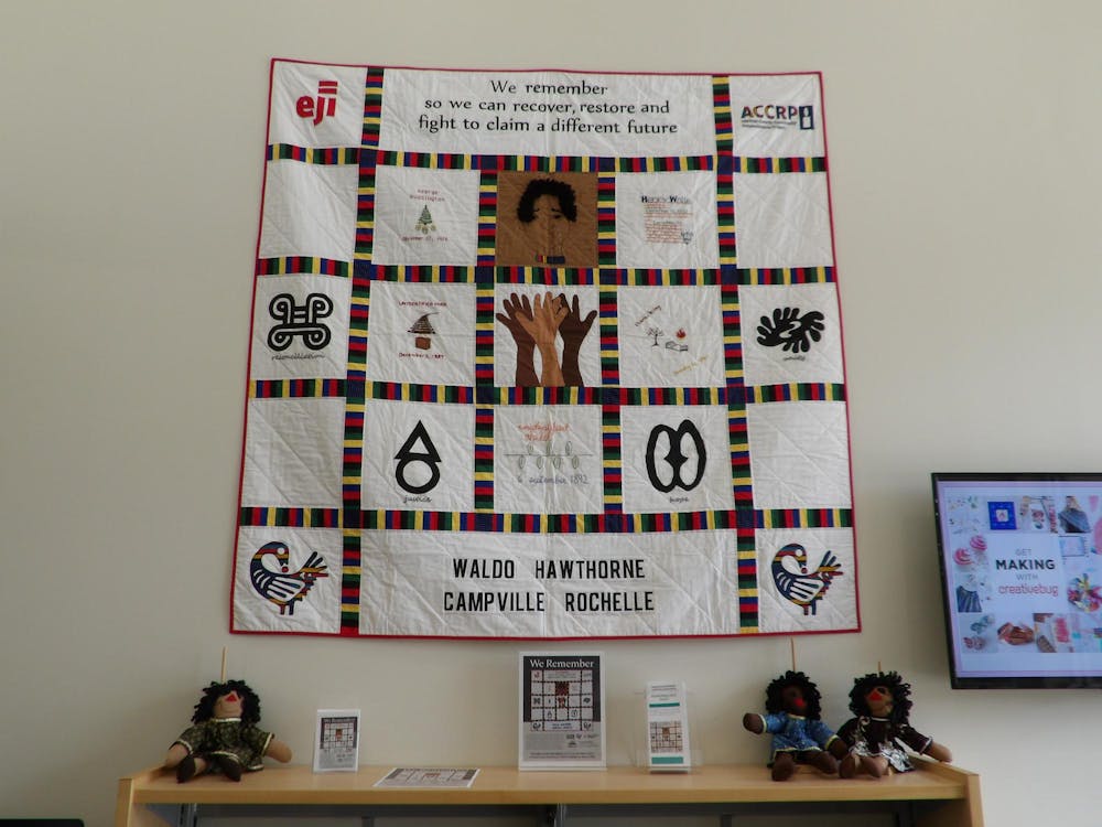 Unveiled on Wednesday, June 21, 2024, the Waldo Remembrance quilt hangs at the entrance of the Alachua County Library District Waldo Branch to remind visitors of Alachua County’s history of racial violence.