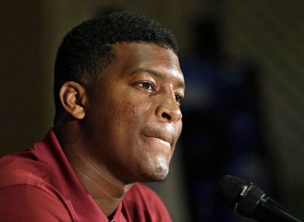 In this July 20, 2014, file photo, Florida State's Jameis Winston answers a question during a news conference at the Atlantic Coast Conference Football kickoff in Greensboro, N.C. Winston has made lewd comments about women and Florida State coach Jimbo Fisher says he is deciding whether to bench the Seminoles' quarterback for his "derogatory" remarks. Several students tweeted Winston stood on campus Tuesday and shouted a lascivious comment that may have derived from an internet meme.