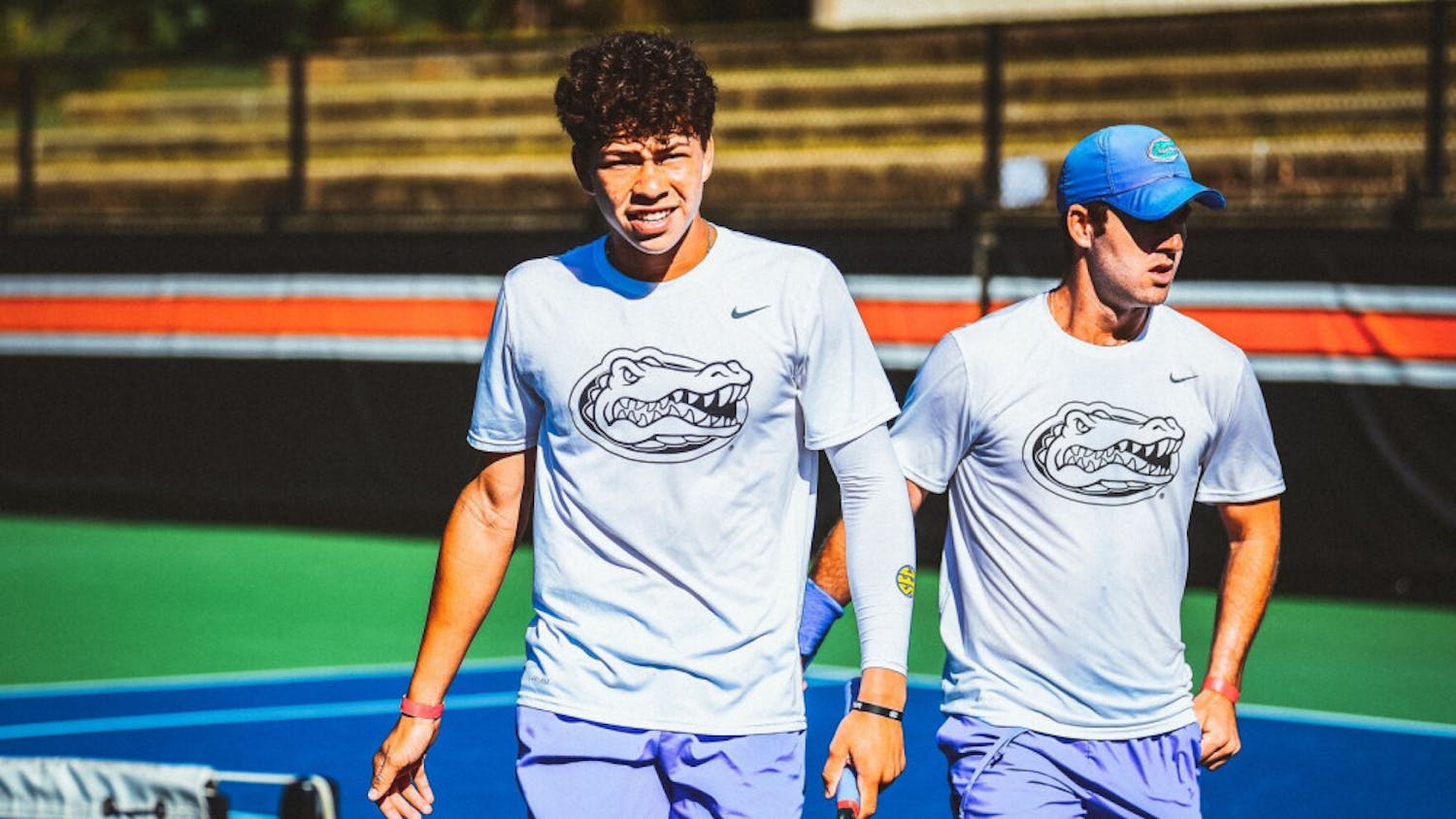 Freshman Ben Shelton walks alongside doubles teammate Will Grant after dropping a match, 8-7, against Auburn on Oct. 2 at the Tiger Fall Invitational in Auburn, Alabama.