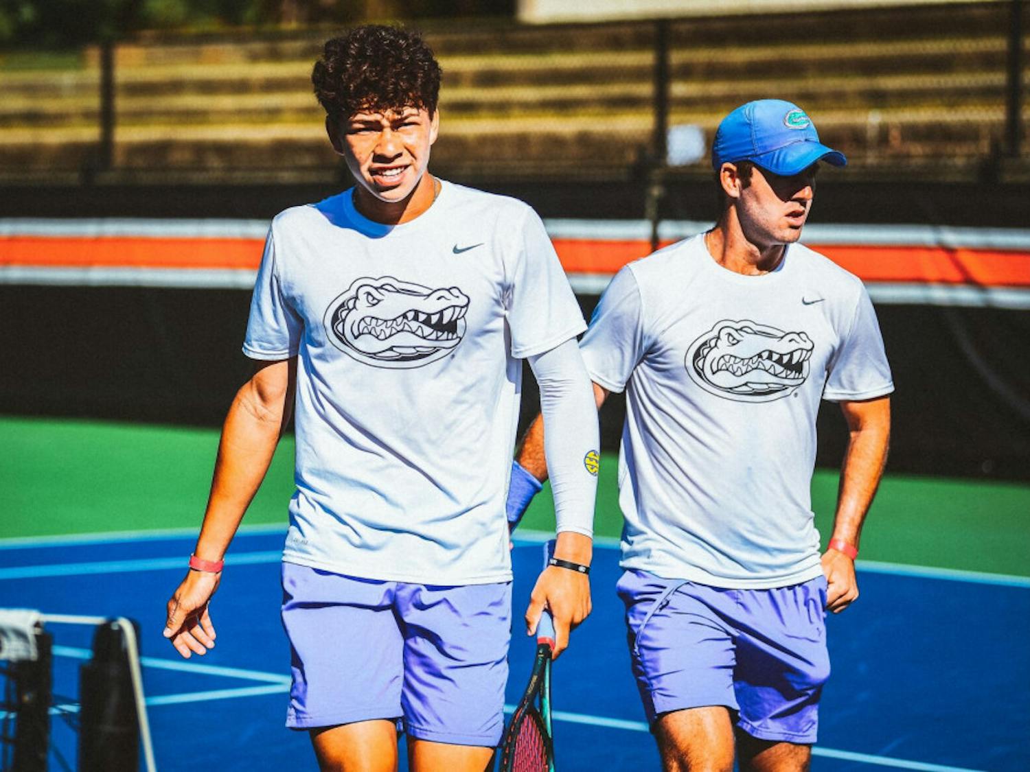 Freshman Ben Shelton walks alongside doubles teammate Will Grant after dropping a match, 8-7, against Auburn on Oct. 2 at the Tiger Fall Invitational in Auburn, Alabama.