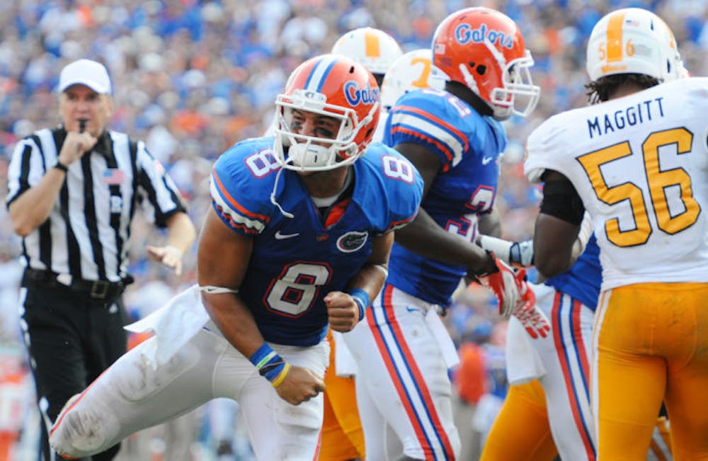 <p>Trey Burton celebrates a touchdown during UF’s 33-23 win against Tennessee on Sept. 17, 2011. &nbsp;Burton has been listed at three different positions for the Gators since 2010. Florida listed him at wide receiver in its 2013 media guide on Monday.</p>