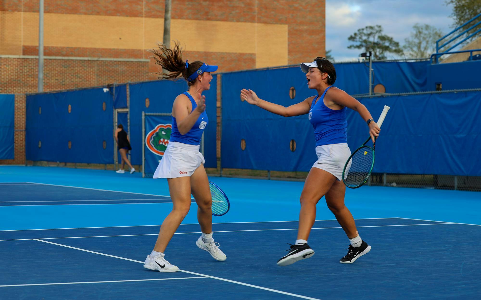 Florida’s Valery Gynina celebrates with her partner Brooke Black during an NCAA women’s doubles tennis match against Kentucky, March 12, 2026, in Gainesville, Fla.