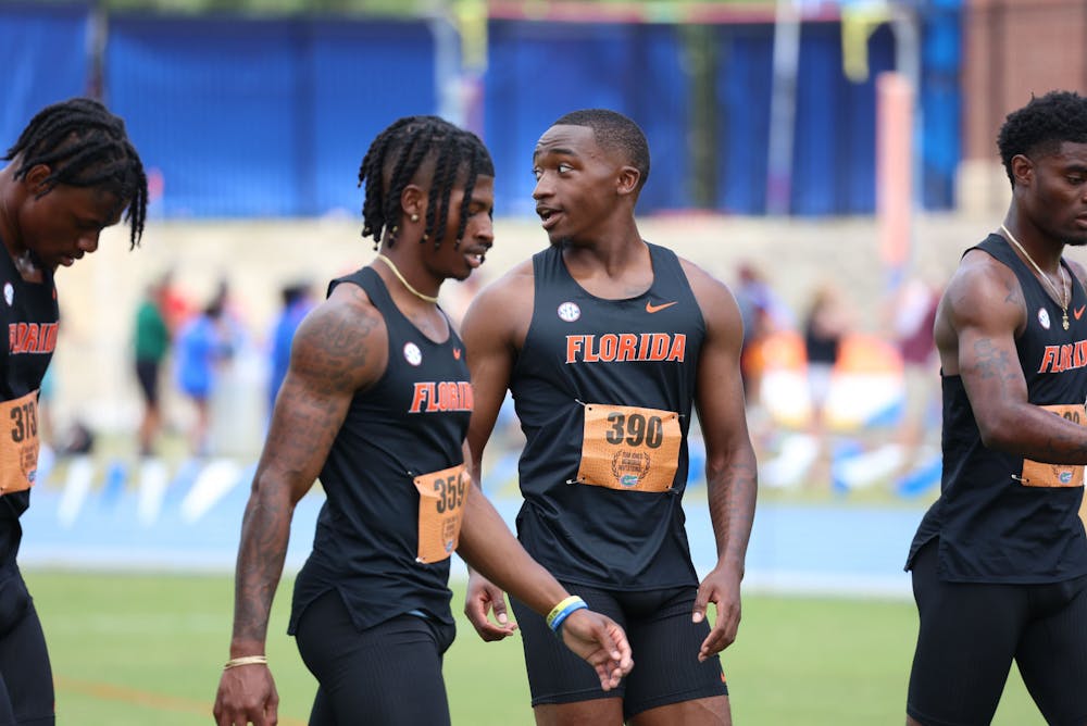 Members of the Florida men's track team talk during the Tom Jones Memorial April 14-15, 2023. 