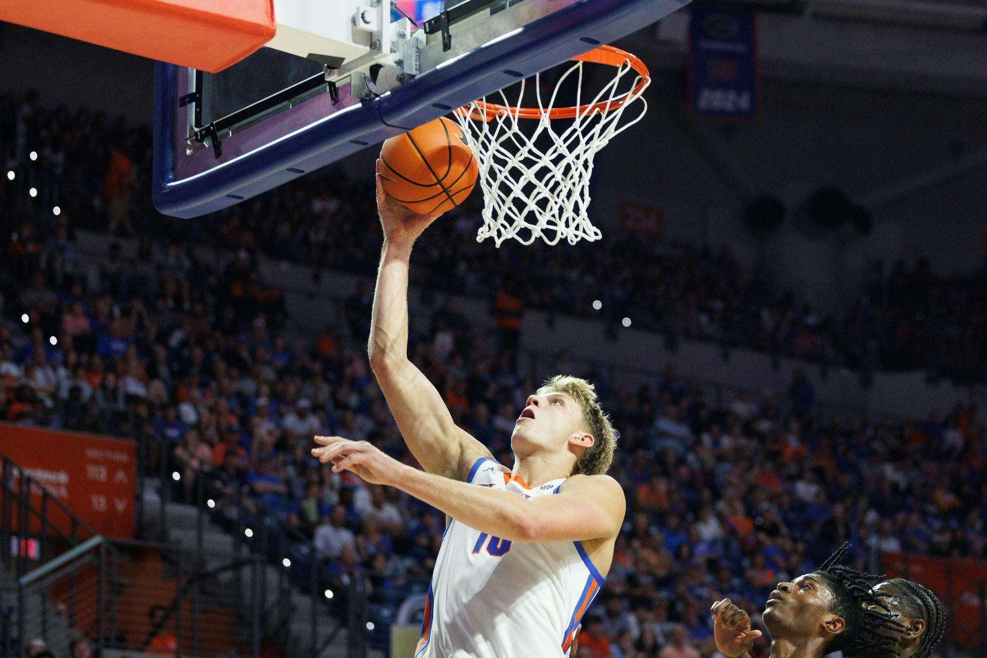 Florida Gators forward Thomas Haugh (10) takes a layup during the first half of a NCAA college basketball game against Merrimack, Friday, Nov. 21, 2025, in Gainesville, Fla.