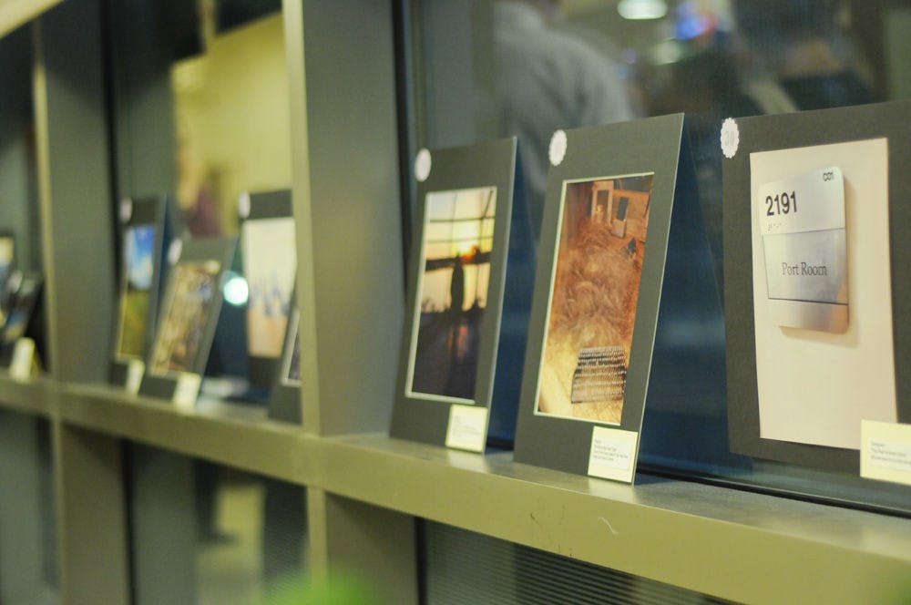 Photographs taken by UF Health pancreatic cancer survivors and caregivers line windows at the Criser Cancer Resource Center located in the UF Health Shands Cancer Hospital on Nov. 12, 2015. The photos were a part of a research study “Assessing the Benefits of PhotoVoice,” led by Shan Wong, 27-year-old UF clinical and health psychology graduate student. “It’s literally giving cameras to participants and having them tell us the stories of their lives and experiences through their pictures,“ Wong said.