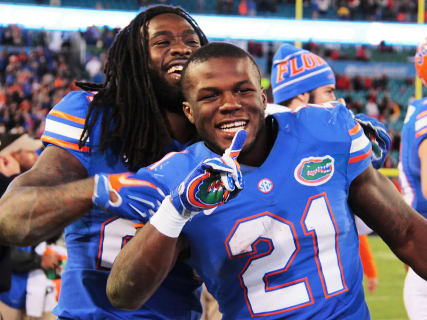 Florida running backs Matt Jones and Kelvin Taylor celebrate following UF's 38-20 win against UGA on Saturday at EverBank Field in Jacksonville.