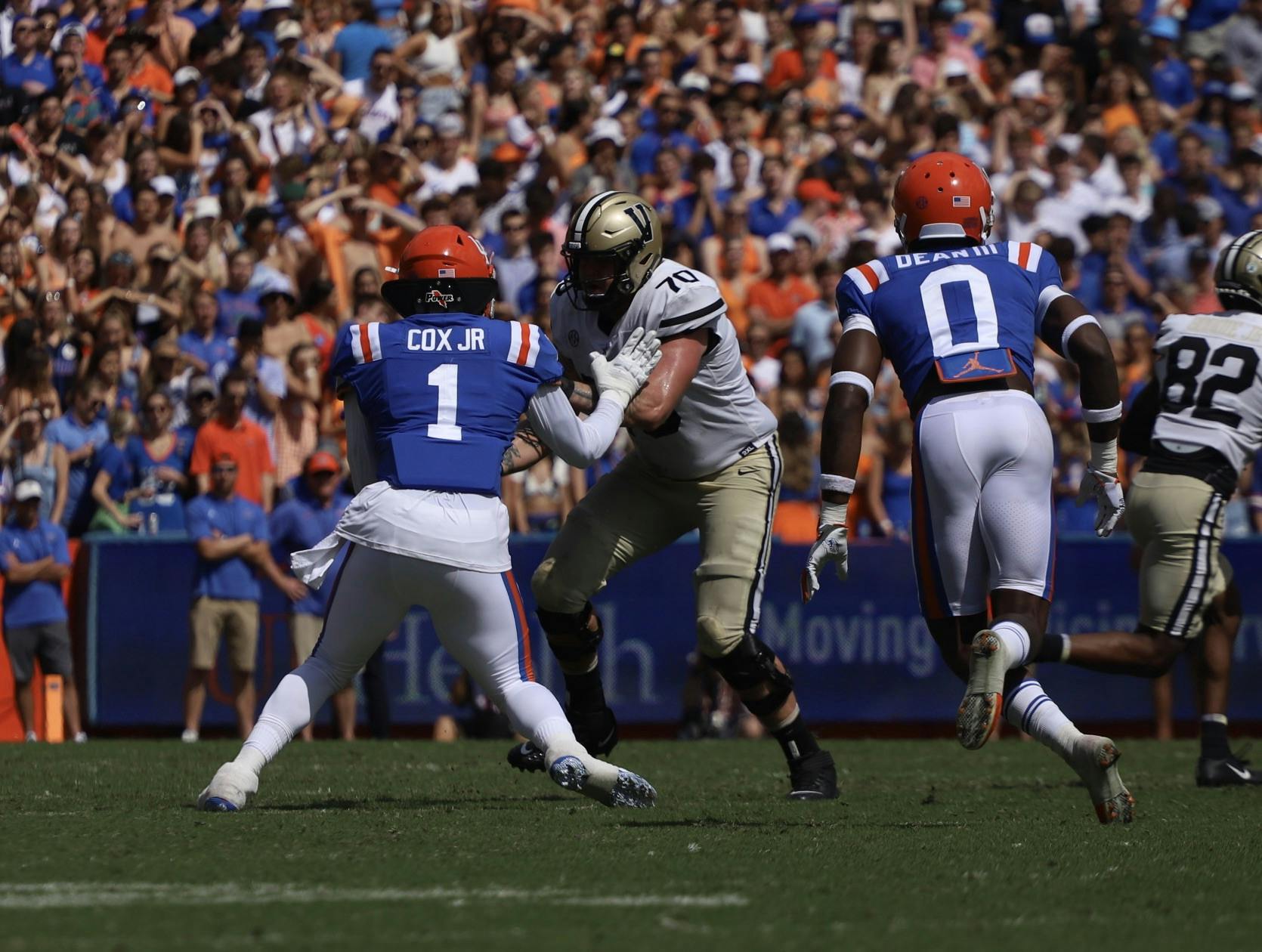 Florida's Brenton Cox Jr. (1) played for Georgia to begin his collegiate career, and Trey Dean III (0) grew up in the Peach State.