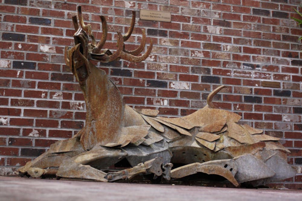 <p>A statue of a metal stag sits outside Persona Vintage Clothing &amp; Costumes on Southeast Second Place. The statue is one of many from the private collection of Alfred Browning Parker. The works debuted Tuesday.</p>
