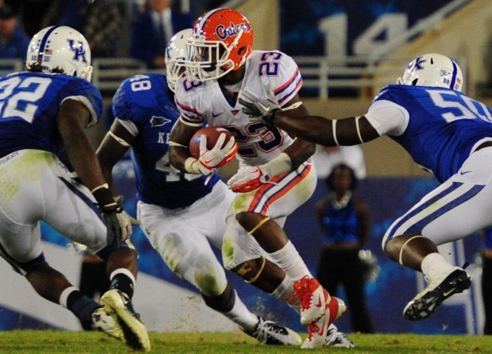 <p>Senior running back Mike Gillislee runs the ball in a 48-10 win against Kentucky on Sept. 24, 2011. At the 2012 SEC Media Days in July, Gillislee predicted he would run for 1,500 yards and 24 touchdowns this season.</p>