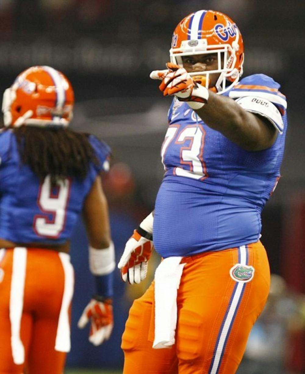 <p>Defensive tackle Sharrif Floyd points to a teammate during Florida’s 33-23 loss to Louisville in the Sugar Bowl on Jan. 2 in New Orleans.</p>