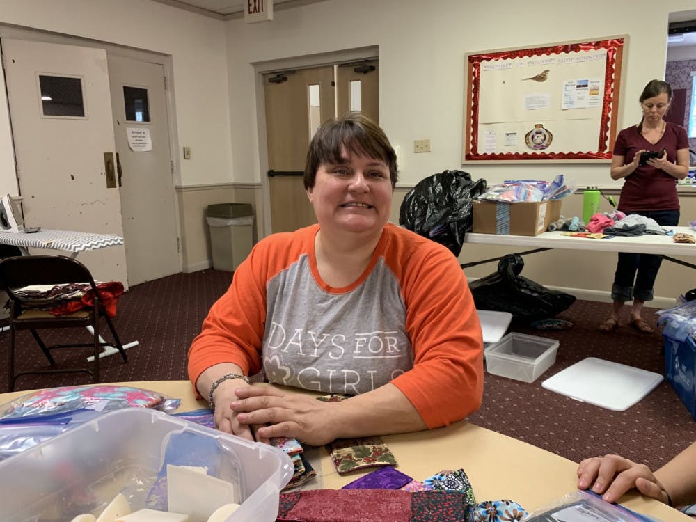 Michelle Belanger, co-leader of Days for Girls Alachua, preps shields and panty liners into Ziploc bags to be ready for kit assembly.
