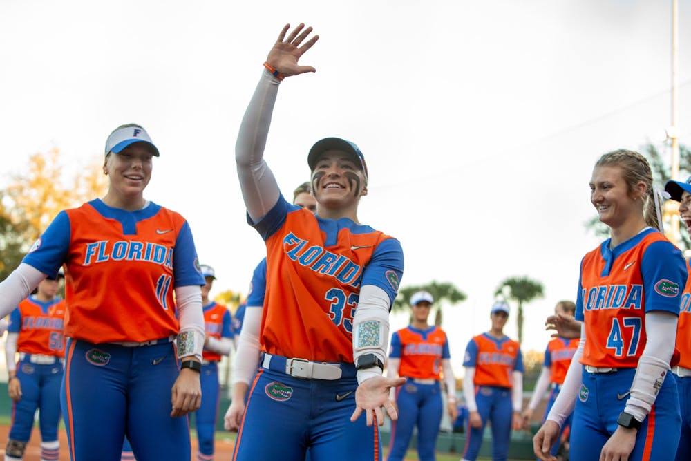 Korbe Otis does the Gator chomp before Florida softball's matchup with Oklahoma State on Feb. 20. Photo by Ryan Friedenberg