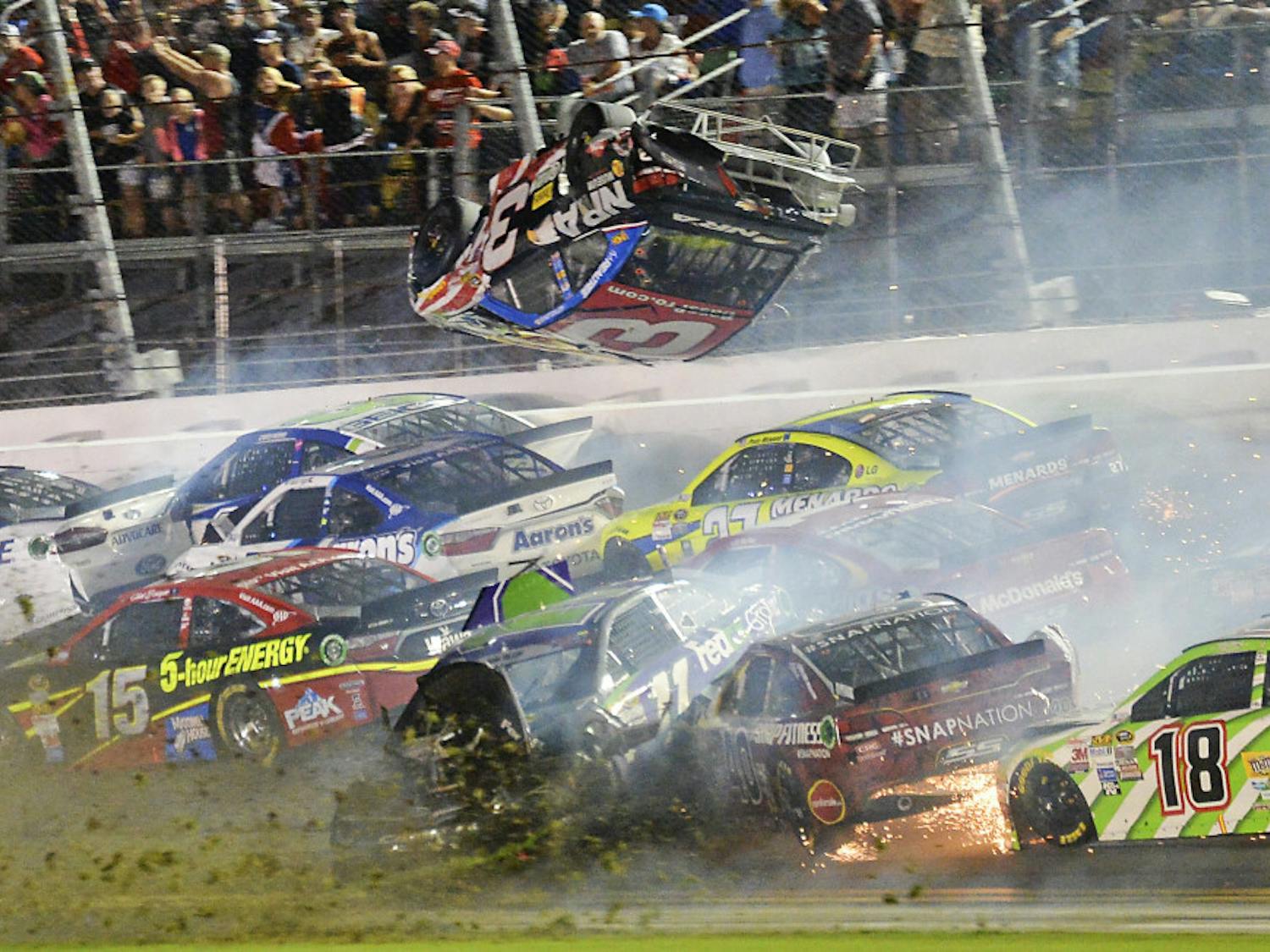 Austin Dillon (3) goes airborne as he was involved in a multi-car crash on the final lap of the NASCAR Sprint Cup series auto race at Daytona International Speedway in Daytona Beach, Florida.