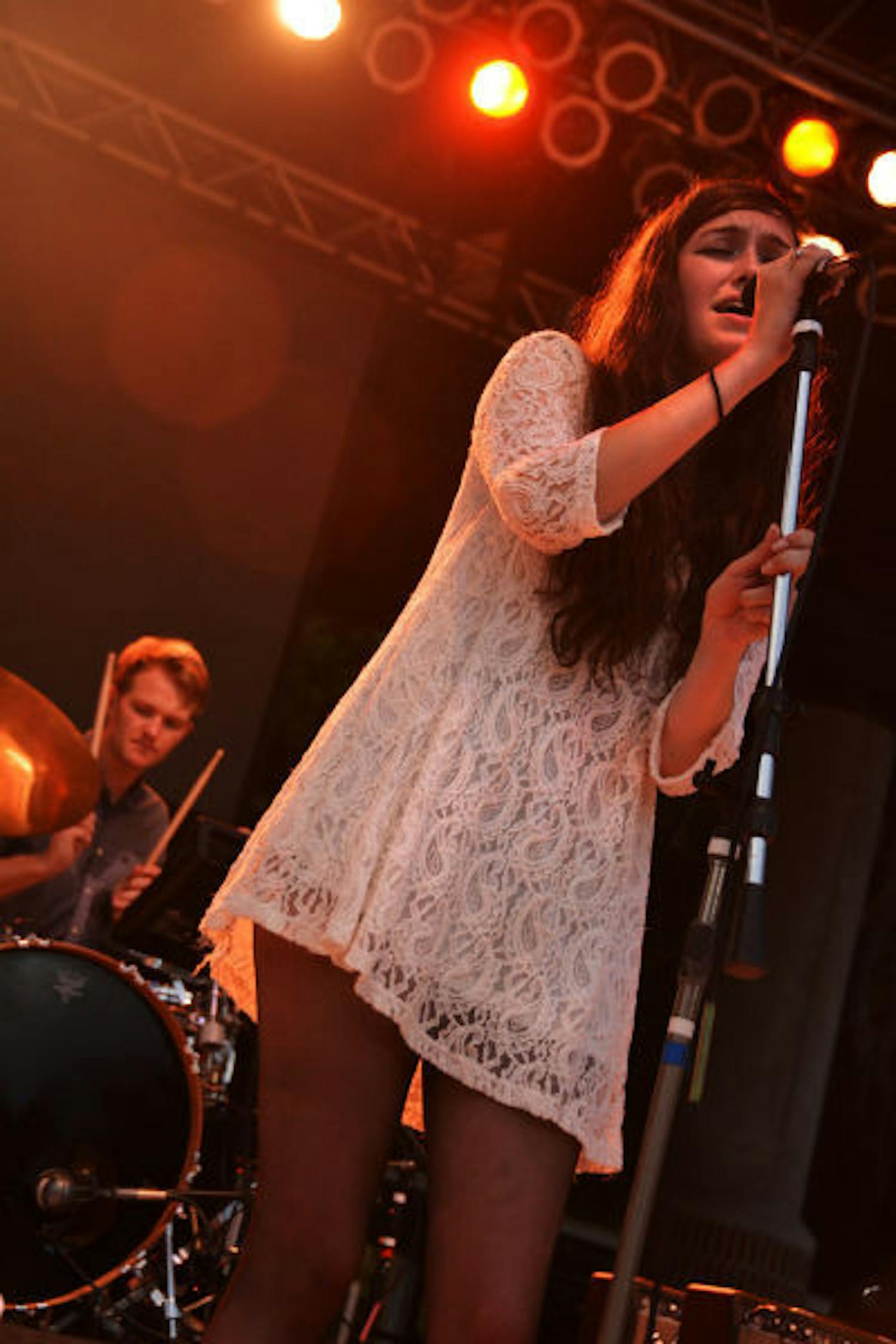 Madeline Follin, of Cults, sings on Friday during Swampfest 2013. Cults opened, along with the band AHMIR,&nbsp;for Matt and Kim, whose performance was canceled due to thunderstorms.