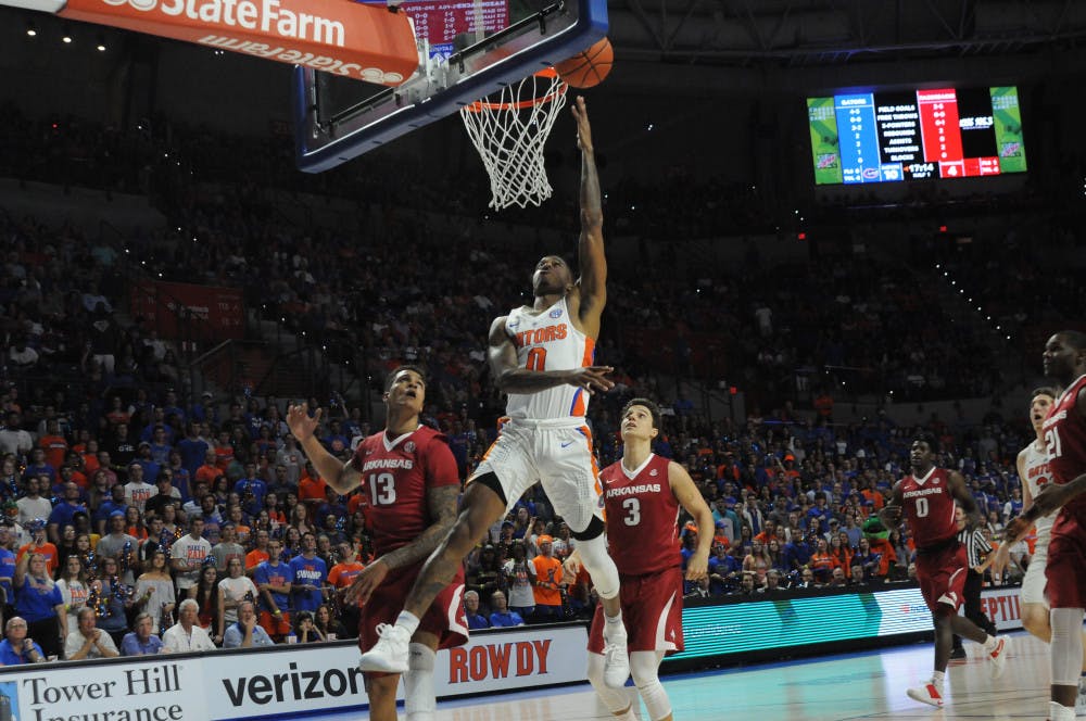 UF guard Kasey Hill attempts a layup in Florida's 78-65 win over Arkansas on Wednesday at the O'Connell Center. 