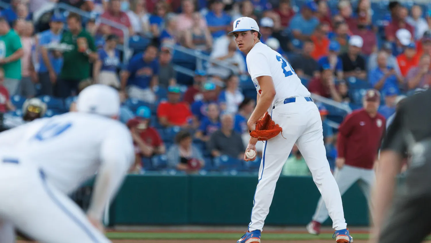 Florida right-handed pitcher Schuyler Sandford (20) watches the first base runner during an NCAA baseball game against Florida State University, Tuesday, March 10, 2026, in Gainesville, Fla.