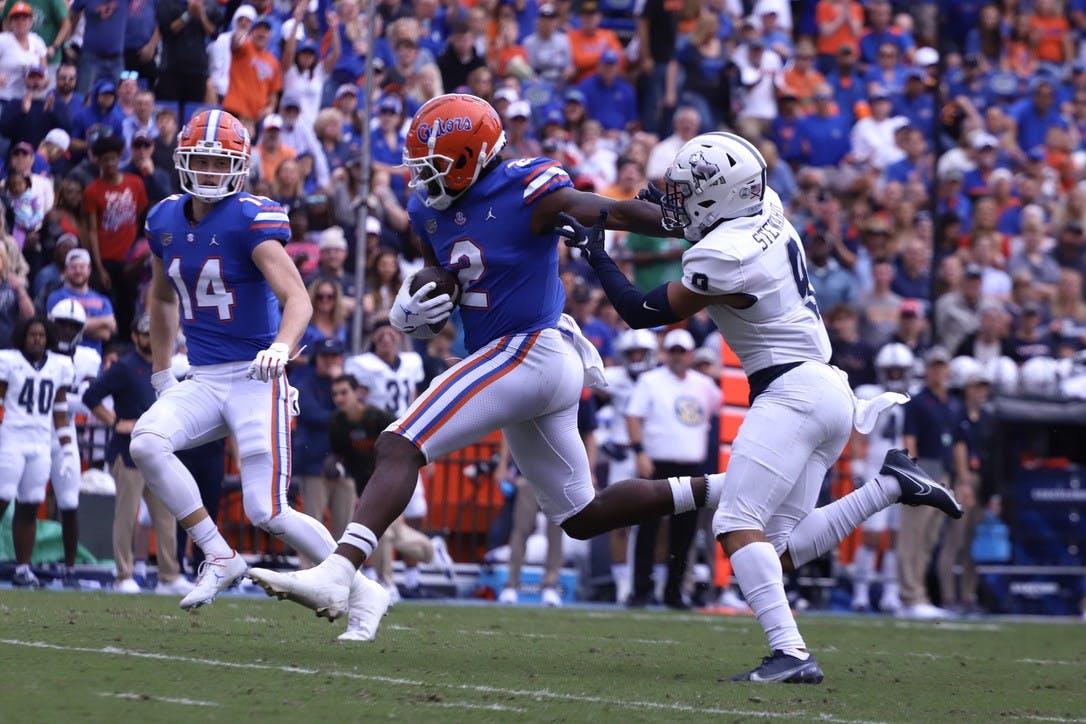 Florida tight end Kemore Gamble fights off Samford safety Midnight Stewart during the Gators 70-52 win over the Bulldogs on Nov. 13.