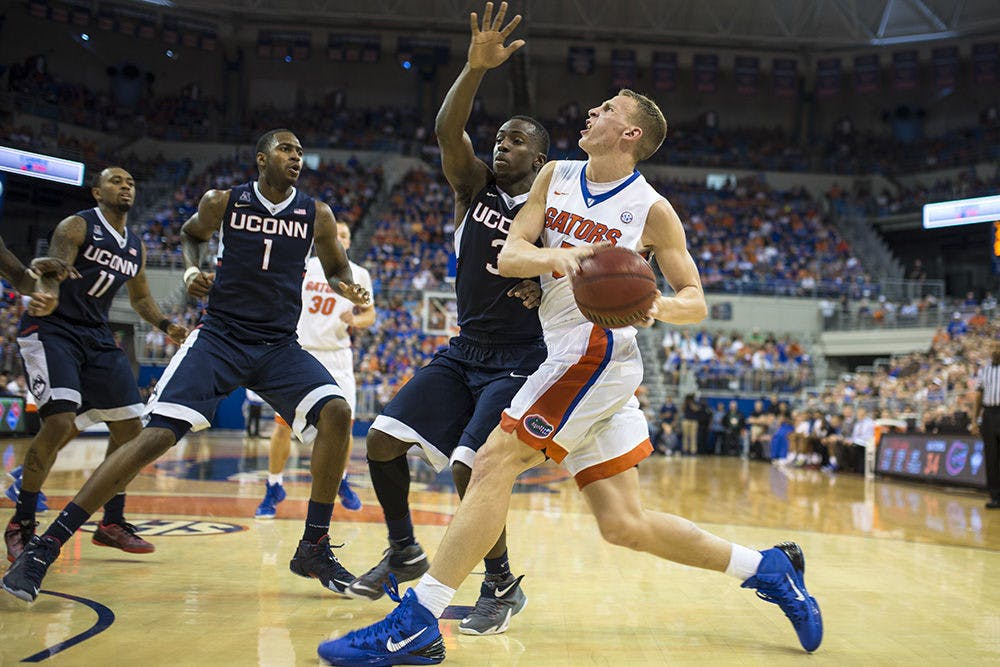 <p>Alex Murphy drives into the paint during Florida's loss to Connecticut in the O'Connell Center.</p>