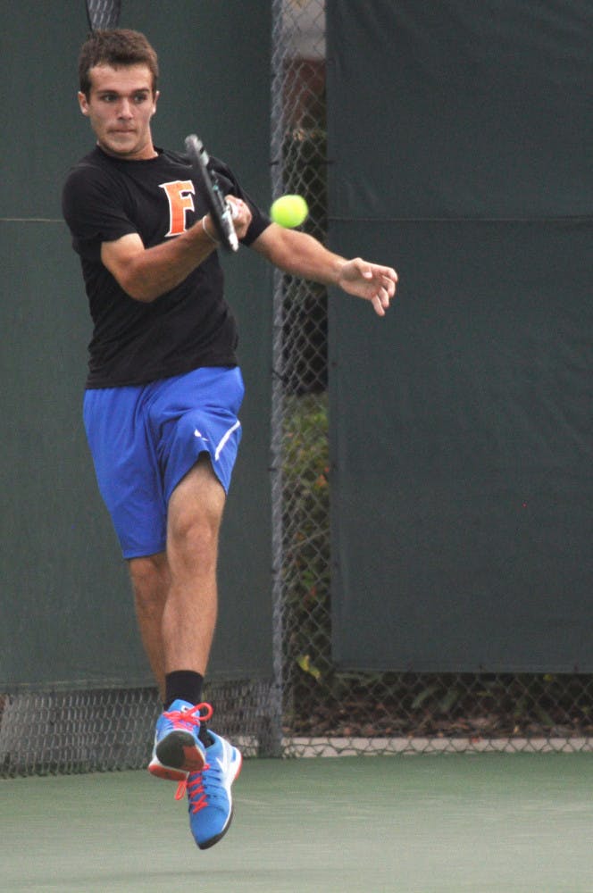 Chase Perez-Blanco hits the ball during Florida's 4-2 win against Alabama on Friday at the Ring Tennis Complex.