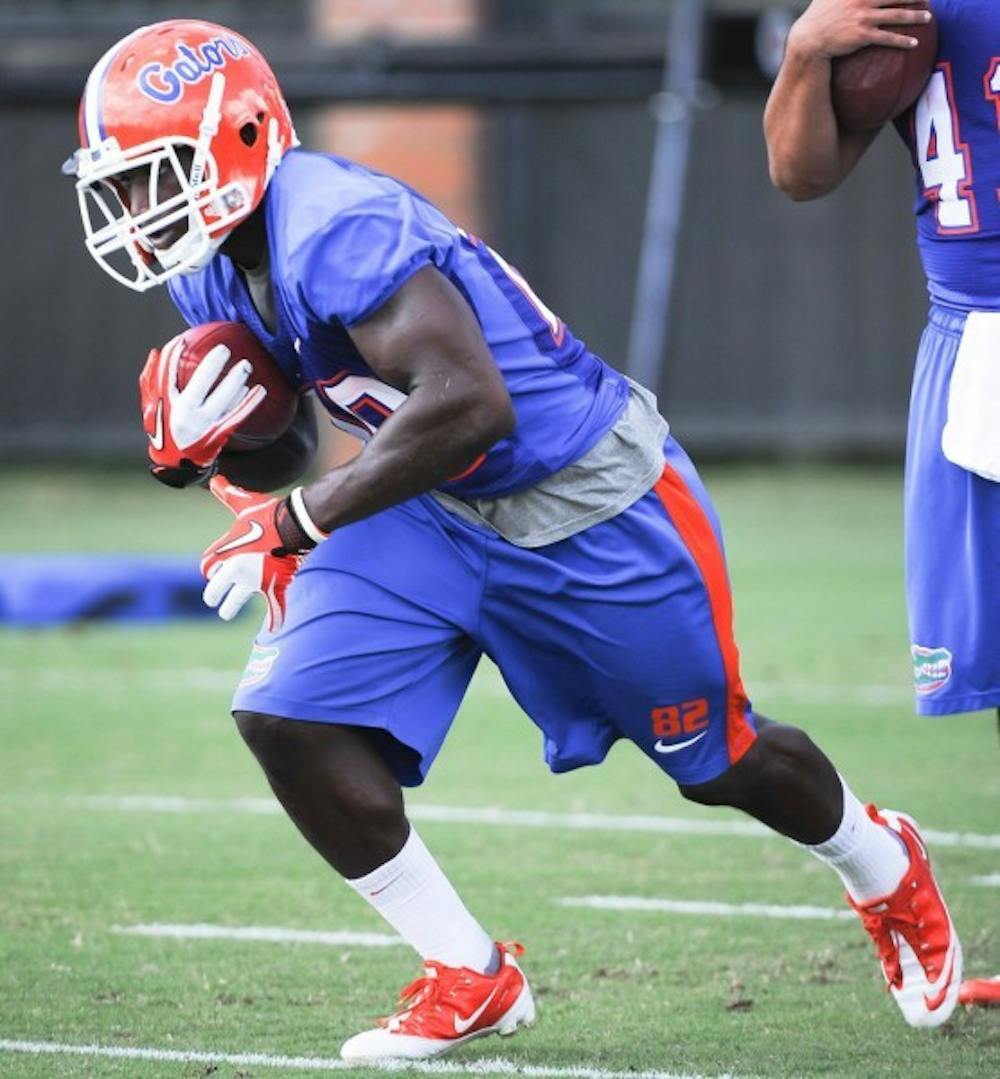 <p>After struggling to find his way onto the field during his first three seasons, Omarius Hines, seen running during a recent practice, is making the switch to running back.</p>
