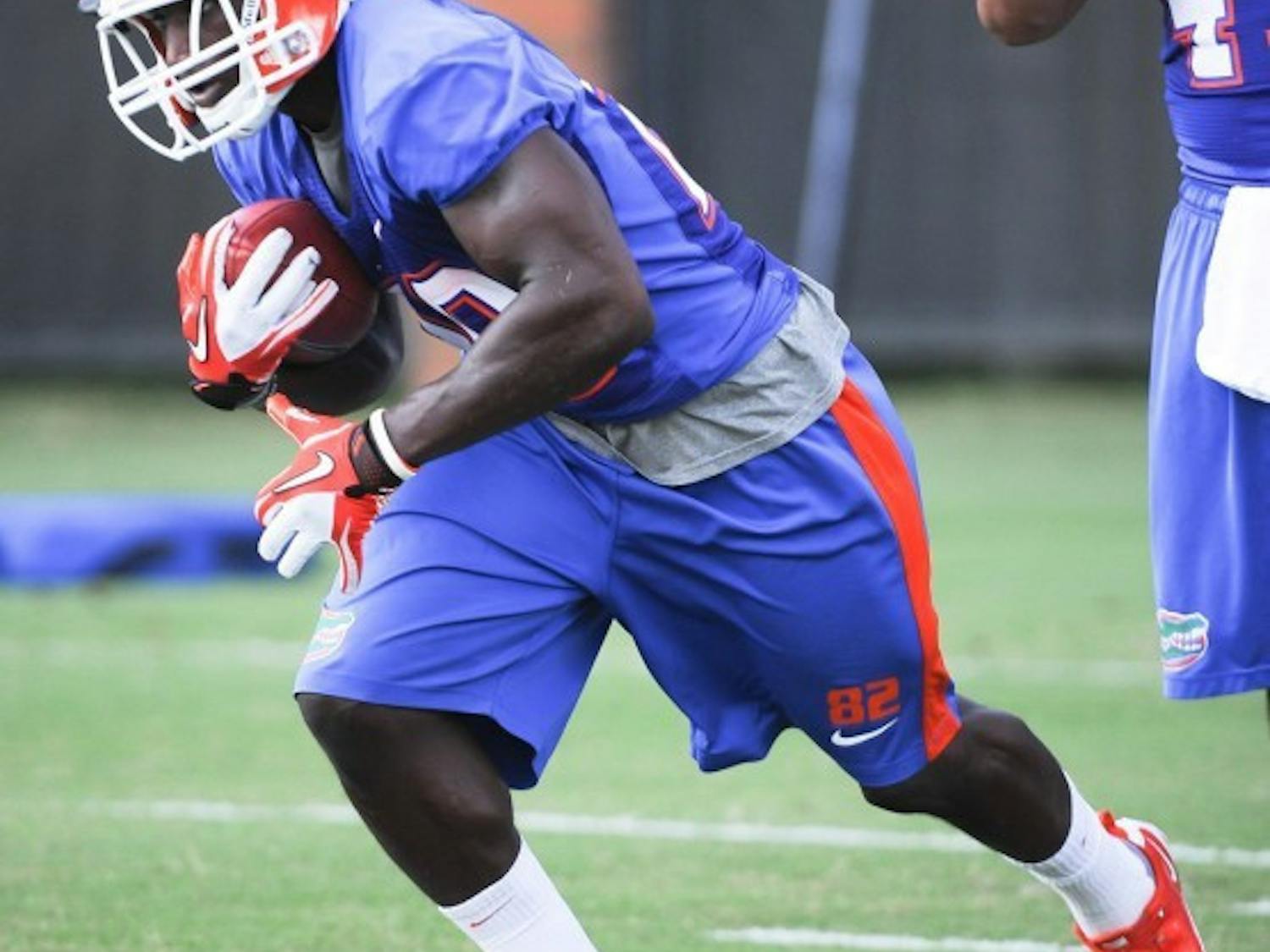 After struggling to find his way onto the field during his first three seasons, Omarius Hines, seen running during a recent practice, is making the switch to running back.