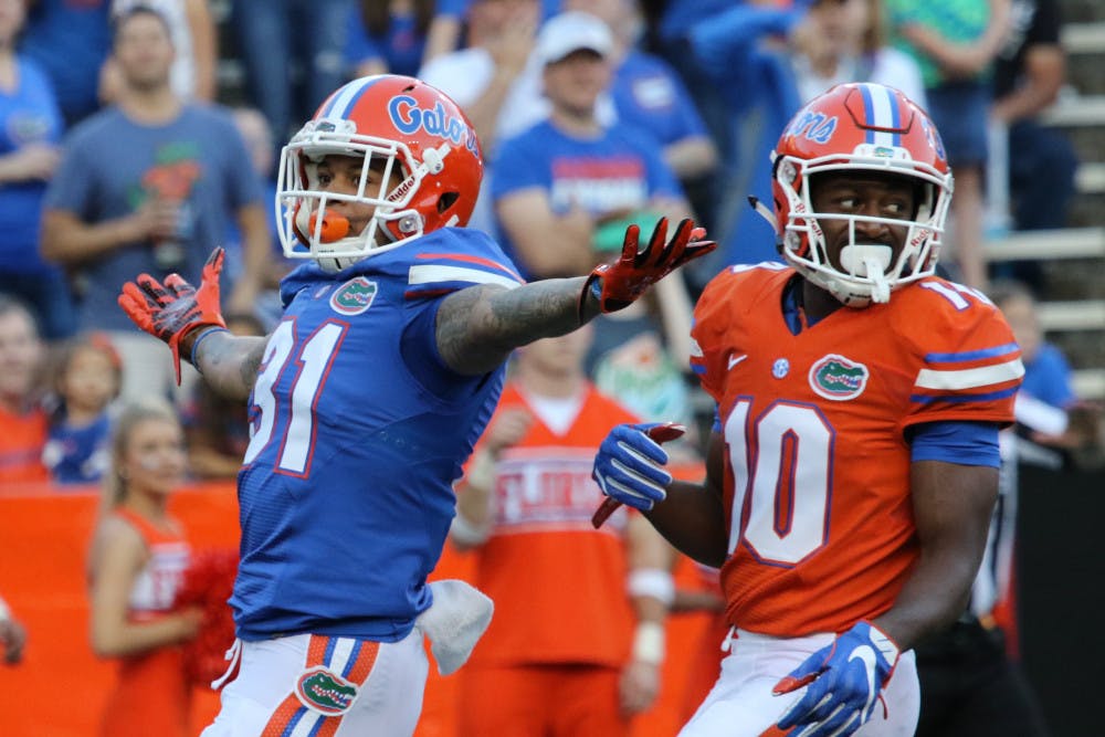 Cornerback Jalen Tabor (31) celebrates after successfully defending wide receiver Josh Hammond (10) during the Orange &amp; Blue Debut on April 8, 2016, at Ben Hill Griffin Stadium.