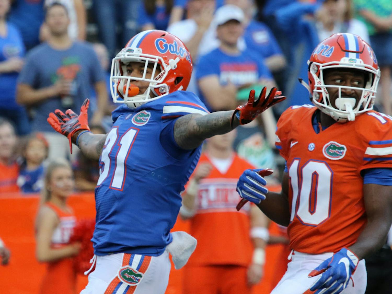 Cornerback Jalen Tabor (31) celebrates after successfully defending wide receiver Josh Hammond (10) during the Orange & Blue Debut on April 8, 2016, at Ben Hill Griffin Stadium.